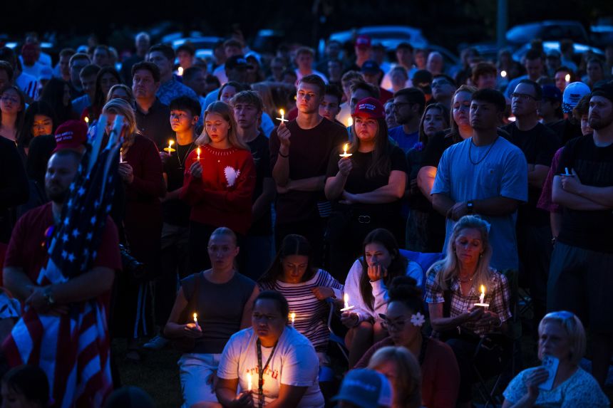 People attend a vigil for political activist Charlie Kirk on September 12, in Provo, Utah.