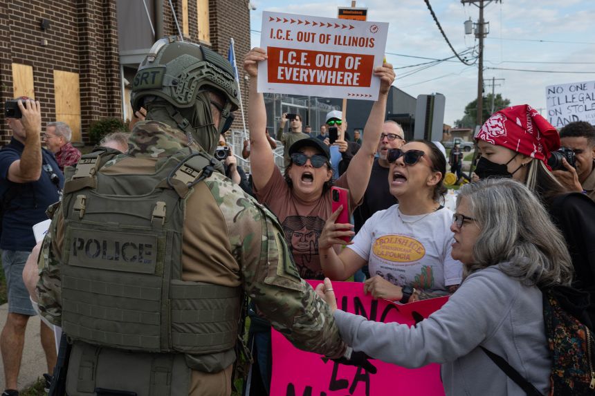 Activists confront federal police during a protest outside of an immigration processing center in Broadview, Illinois, on September 12, 2025.
