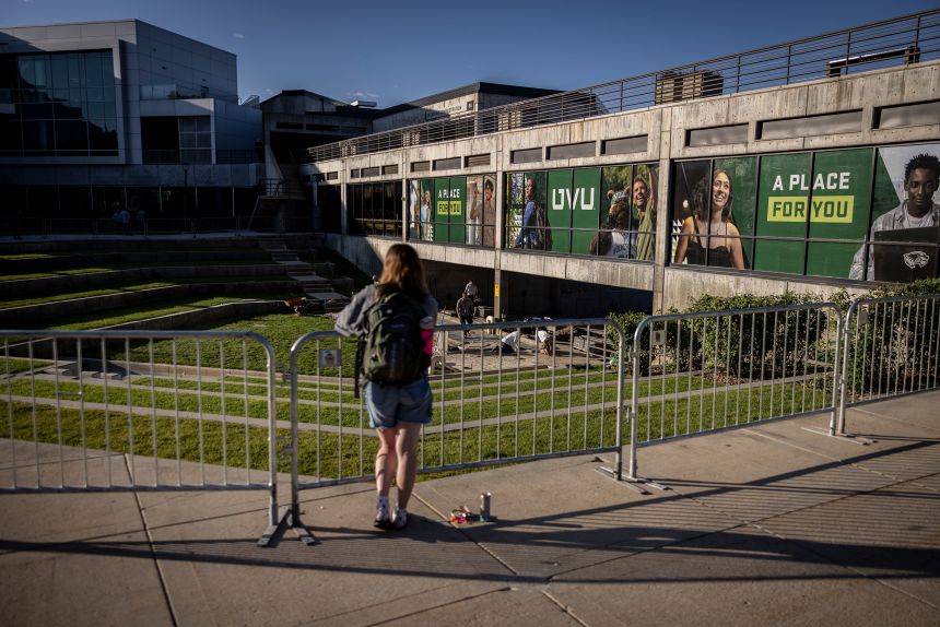 A person looks over the Utah Valley University courtyard where political activist Charlie Kirk was shot.