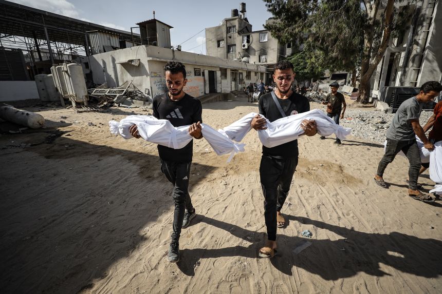 Bodies of Palestinians are taken from Al-Shifa Hospital for funeral ceremonies on Tuesday.