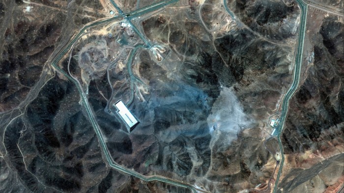 A satellite image shows the Fordow underground complex with visible blast marks and damage near the main facility.
