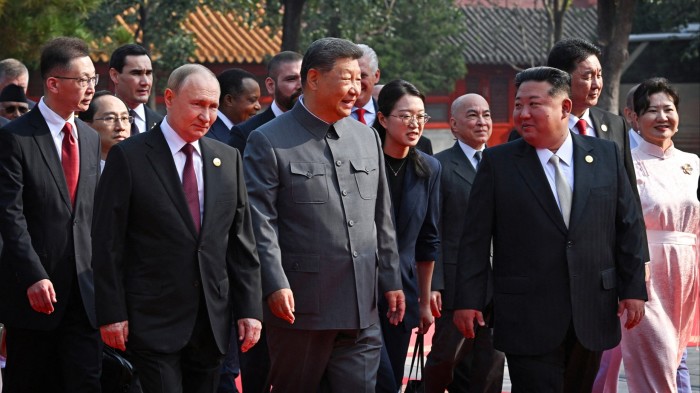 Kim Jong Un takes his place beside Xi Jinping and Vladimir Putin