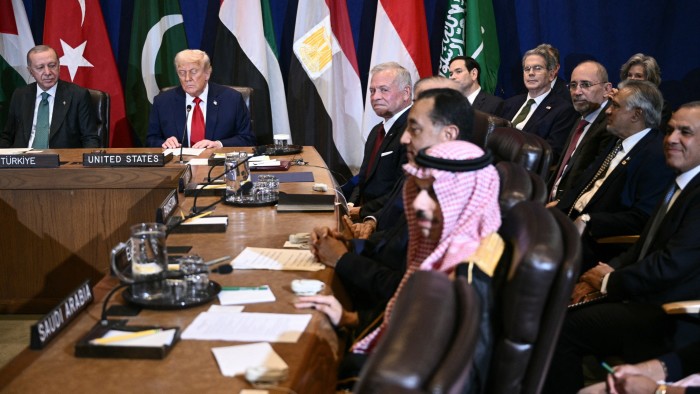 Recep Tayyip Erdogan, Donald Trump, King Abdullah II, Mostafa Madbouly, and Prince Faisal bin Farhan Al Saud seated at a meeting table with country placards.