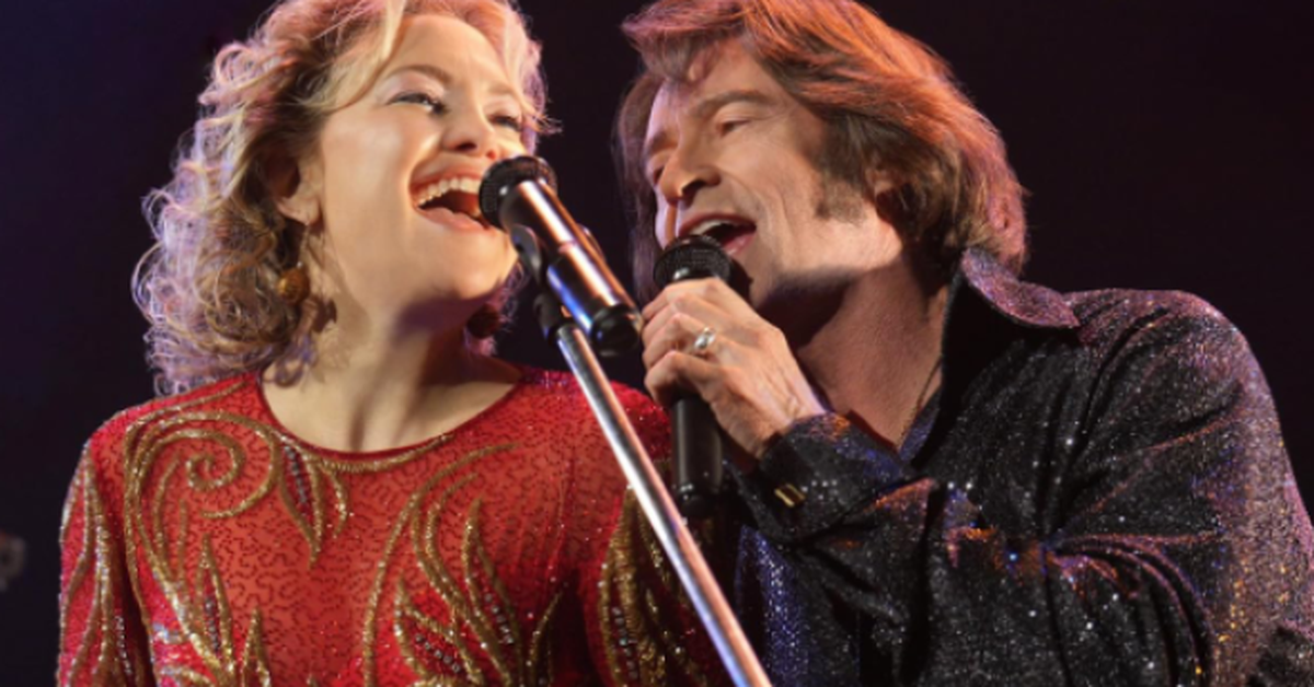 Hugh Jackman transforms into Neil Diamond tribute performer; Rusell Crowe gets standing ovation at Toronto International Film Festival.