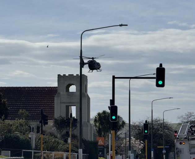 A helicopter arrives at the scene of the crash. Photo: Andrew Ashton 