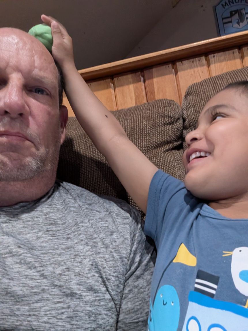 Since starting leucovorin, Jose notices and interacts more with the world around him, said his guardian, Keith Joyce. Here, he's smashing a blob of clay on Keith's head.