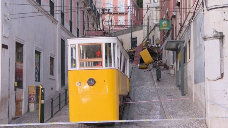 The lower carriage in the foreground with the remains of the one that crashed further up the hill in Lisbon. Pic: AP