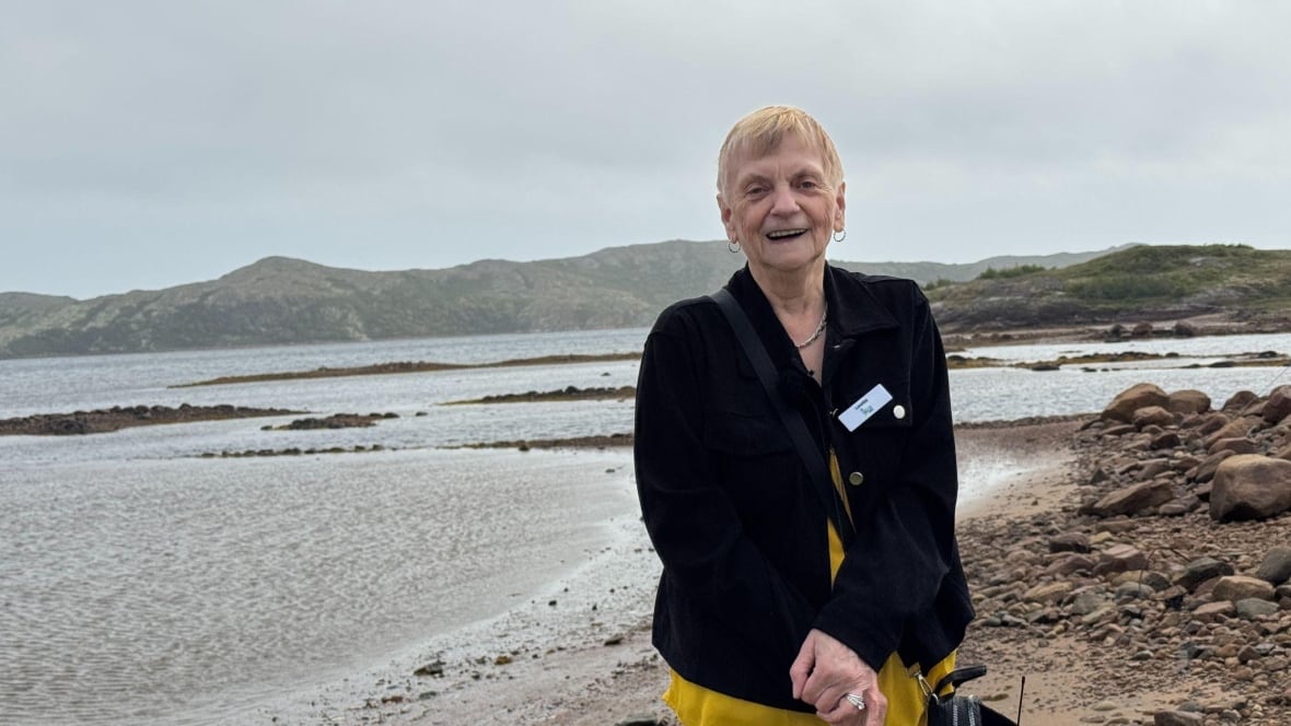 A woman smiles at the camera 