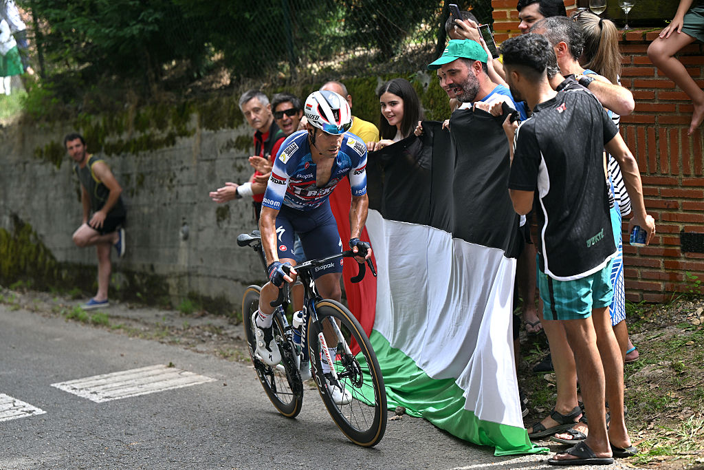 BILBAO, SPAIN - SEPTEMBER 03: Mikel Landa of Spain and Team Soudal Quick-Step competes while a group of fans protest displaying Palestinian flags during the La Vuelta - 80th Tour of Spain 2025, Stage 11 a 157.4km stage from Bilbao to Bilbao / #UCIWT / on September 03, 2025 in Bilbao, Spain. (Photo by Dario Belingheri/Getty Images)
