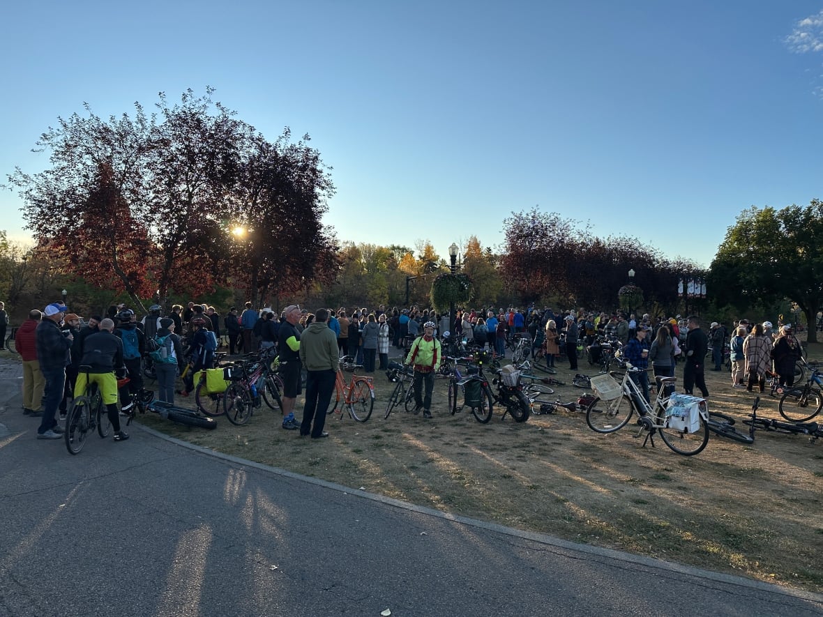 group of bikers gathered in a park