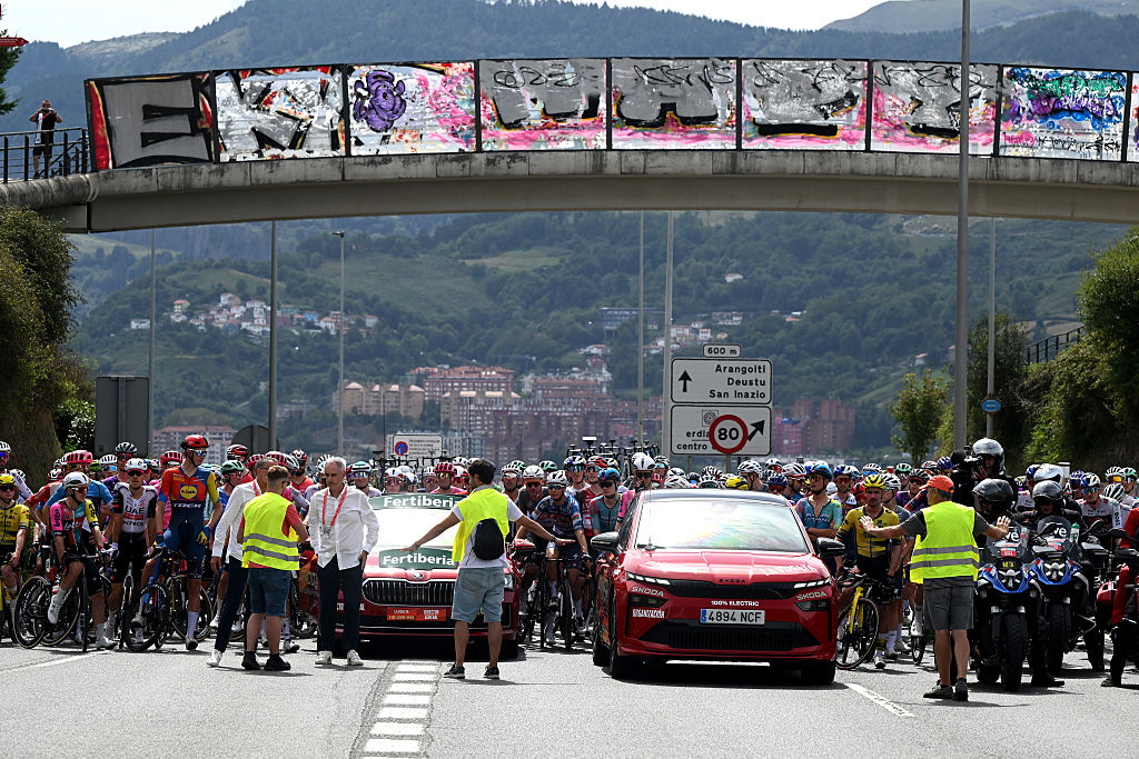 BILBAO, SPAIN - SEPTEMBER 03: A group of fans protest against Team Israel - Premier Tech riders by displaying Palestinian flags and stop the peloton prior to the La Vuelta - 80th Tour of Spain 2025, Stage 11 a 157.4km stage from Bilbao to Bilbao / #UCIWT / on September 03, 2025 in Bilbao, Spain. (Photo by Dario Belingheri/Getty Images)