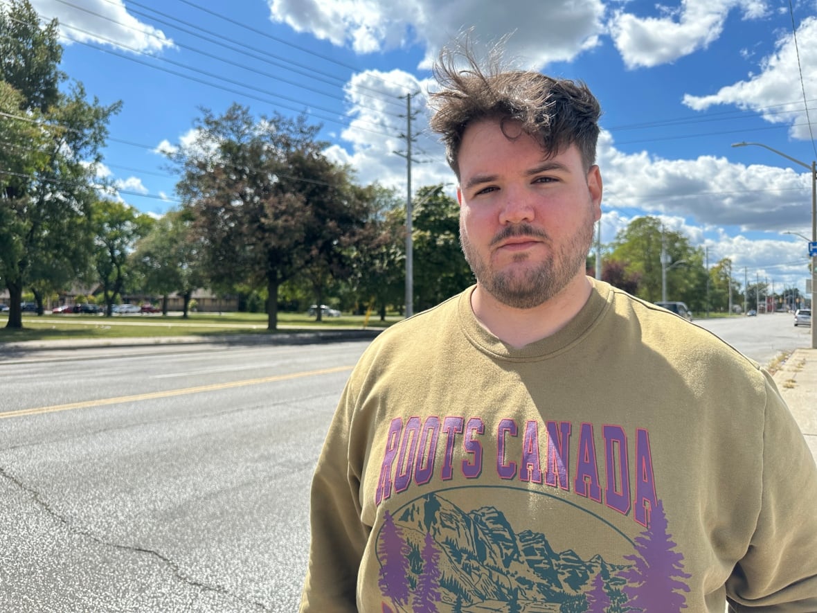 A man in a roots canada shirt.
