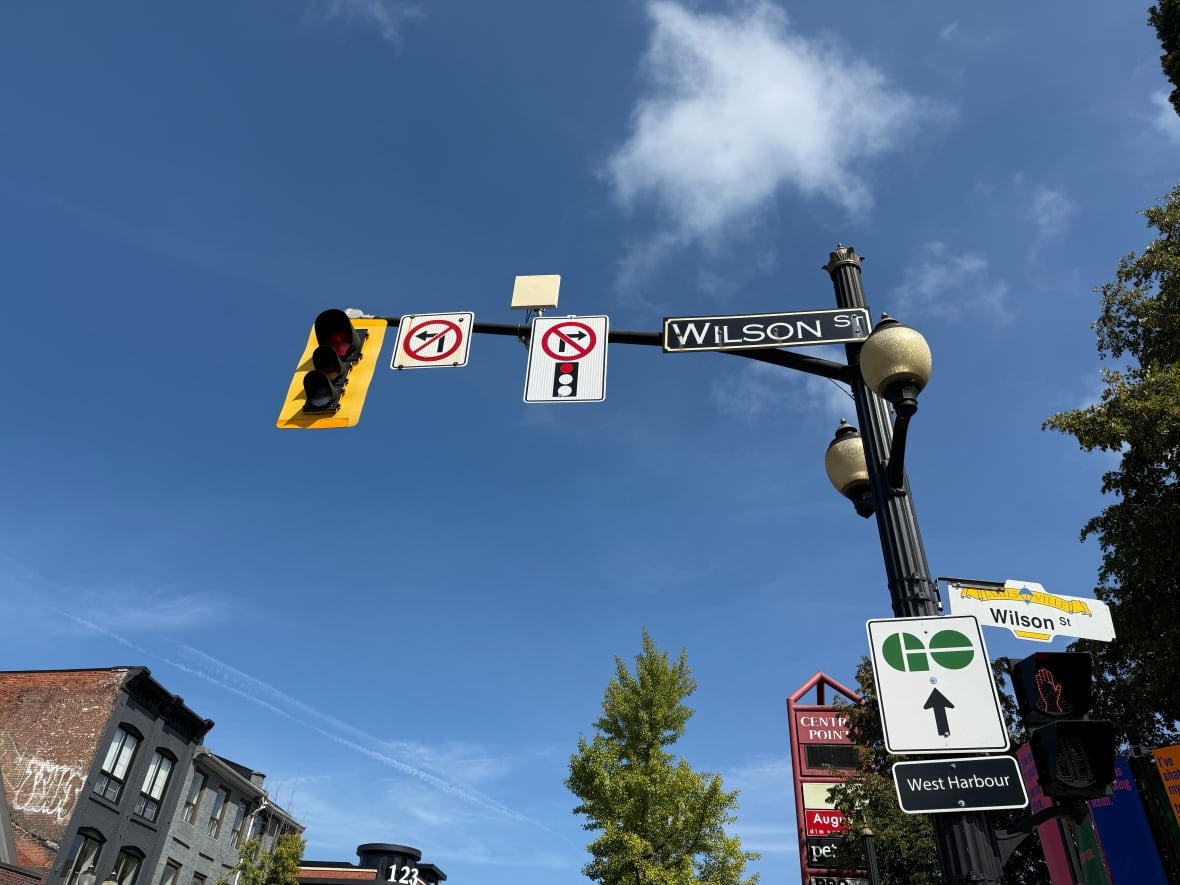 wilson street sign with other traffic signs