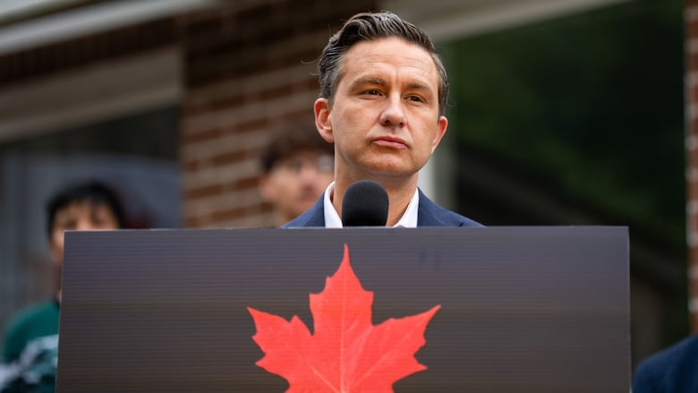 A man stands at a podium.