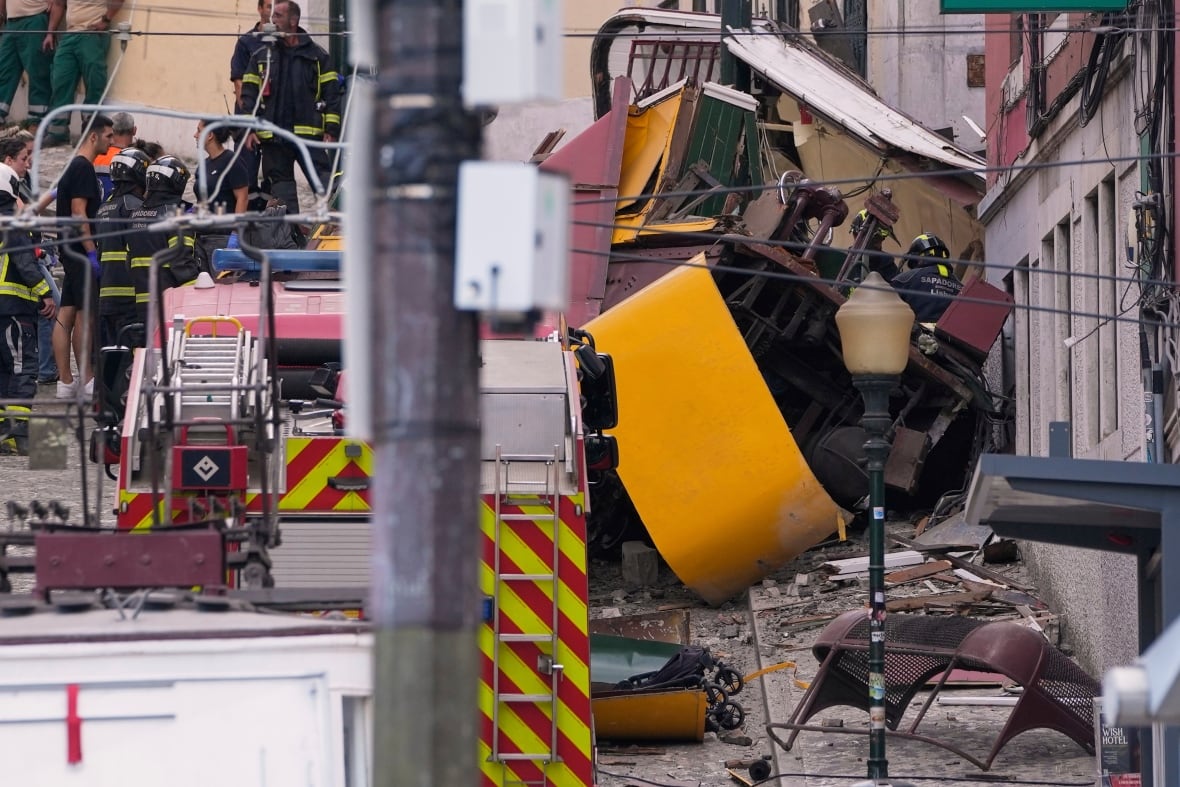 Emergency teams at the scene of a crash involving a funicular in the Portuguese capital of Lisbon.