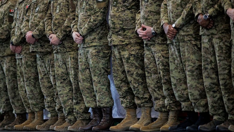 Members of the Canadian Armed Forces await the arrival of Prime Minister Mark Carney ahead of a press conference at Ft. York Armoury, in Toronto, on June 9, 2025.