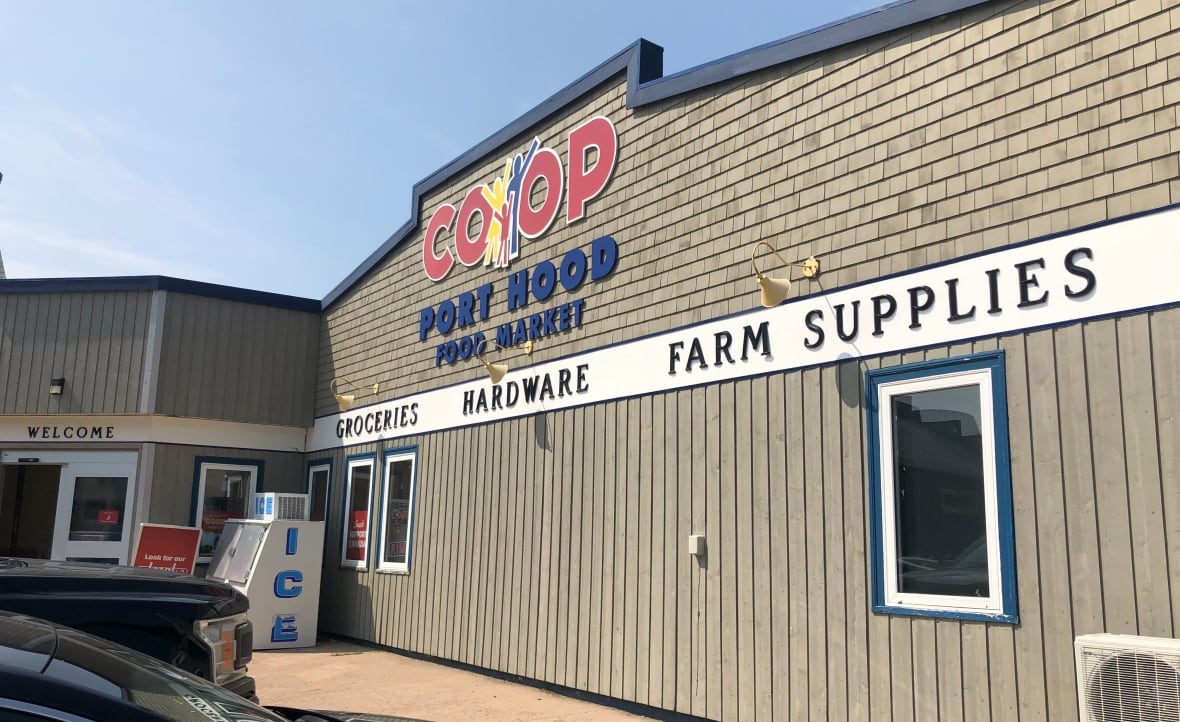 A sign on a building says Co-op Port Hood Food Market.