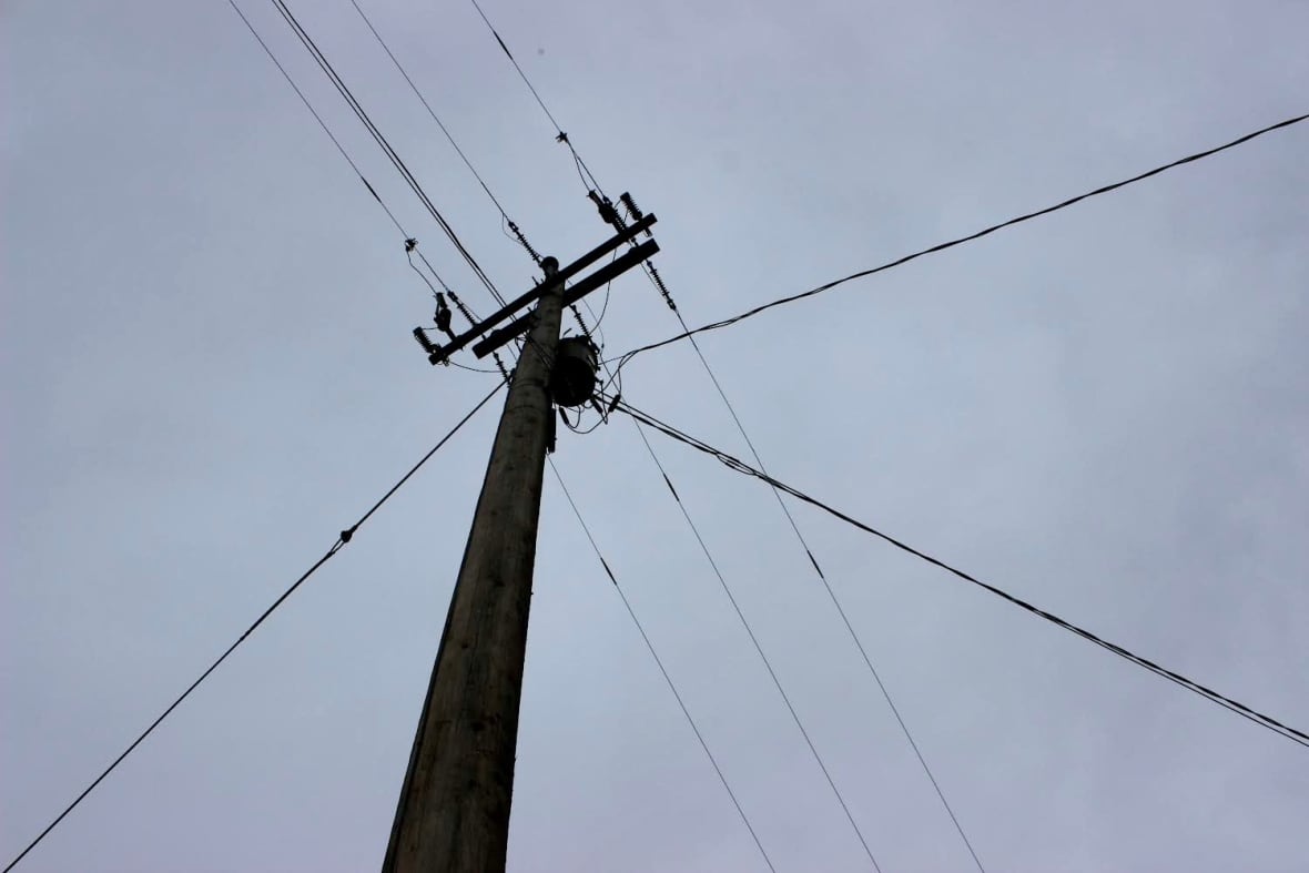 A power pole with lines.