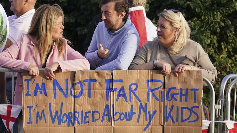 Protesters gather outside the Bell Hotel in Epping, near London.