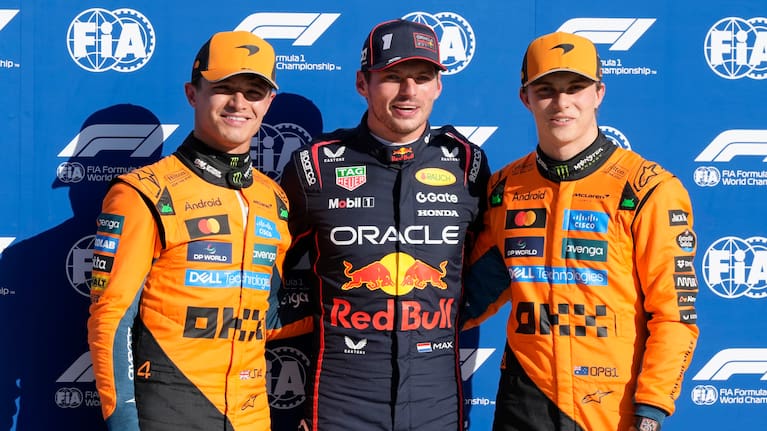 Red Bull driver Max Verstappen of the Netherlands, centre, celebrates his pole position with McLaren driver Lando Norris of Britain, left, and McLaren driver Oscar Piastri of Australia