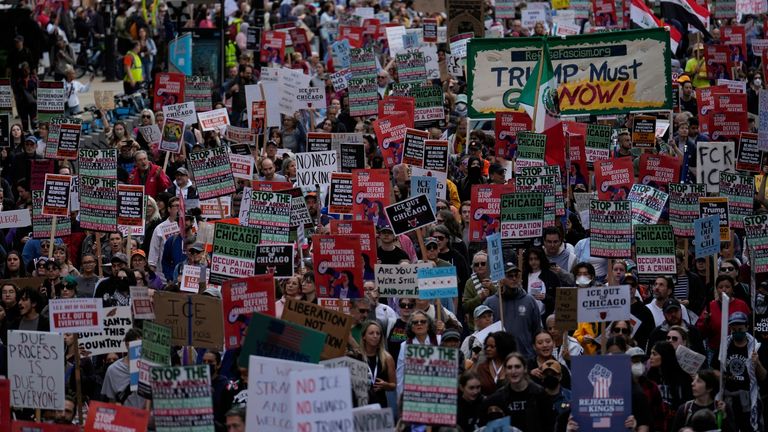 A protest against threatened immigration raids in Chicago on Saturday. Pic: AP