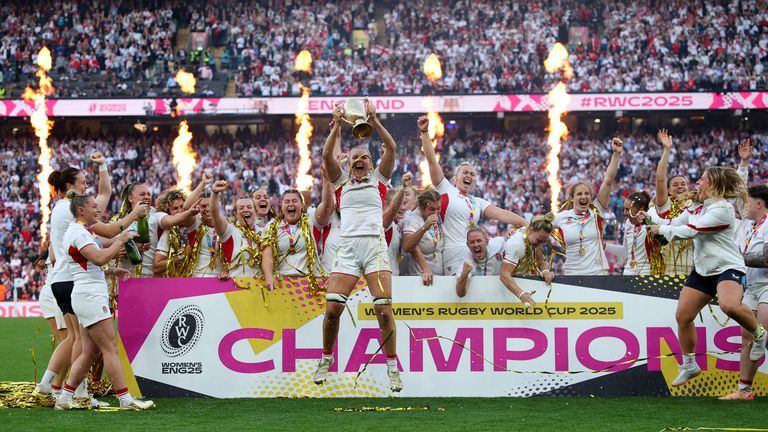 England's Zoe Aldcroft lifts the trophy. Pic: Reuters