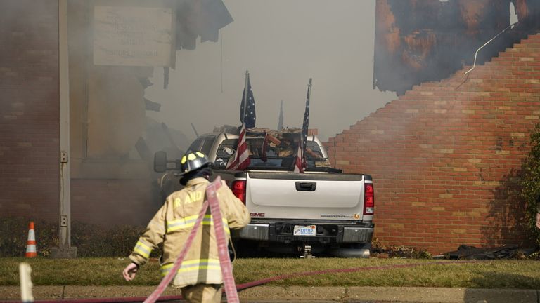 The pickup truck which rammed into the church building. Pic: Lukas Katilius/The Flint Journal/AP