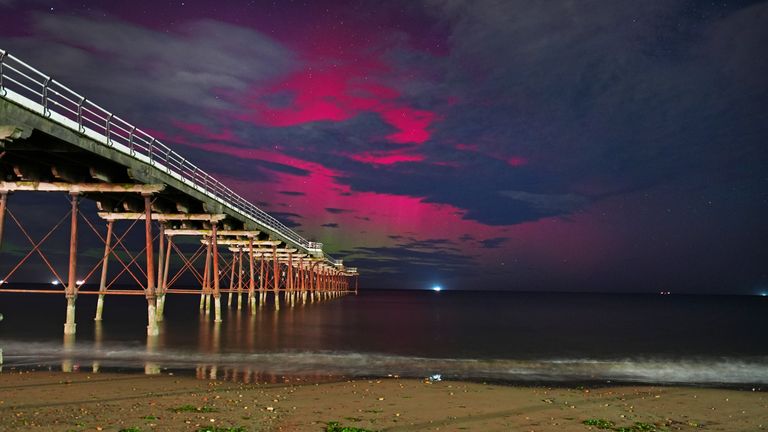 The Northern Lights visible through clouds over Saltburn-by-the-Sea in North Yorkshire. Pics: PA