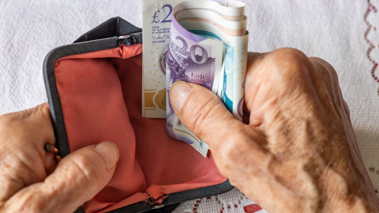 Money in a purse. Pic: iStock