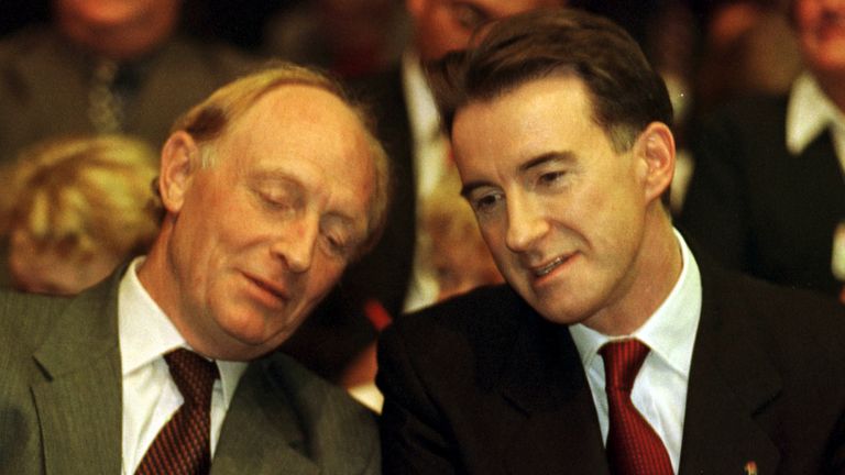 Former Labour leader Neil Kinnock (L) with Labour's Minister Without Portfolio Peter Mandelson, at the party's annual conference in Brighton