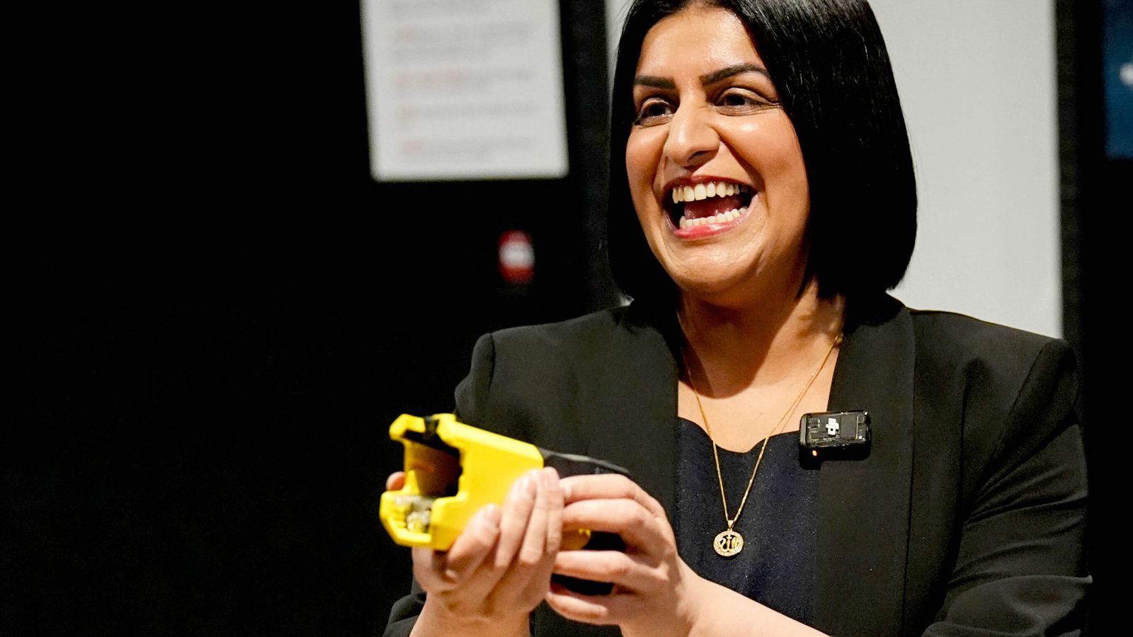 Shabana Mahmood holds a Taser during the launch of a trial of the weapons in July. Pic: PA