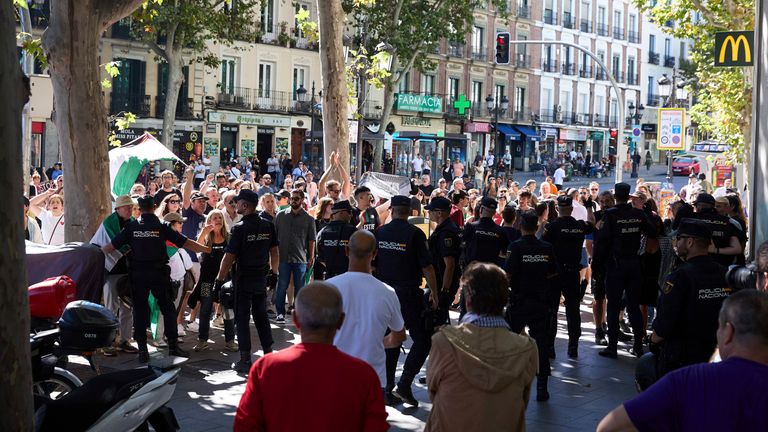 A heavy police presence in Madrid's Atocha district before the final leg began. Pic: AP