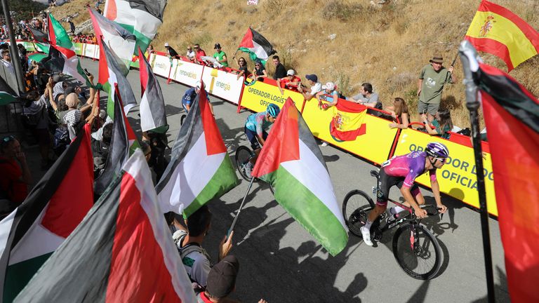 Cyclists pass through an area with pro-Palestinian protests on Saturday. Pic: AP
