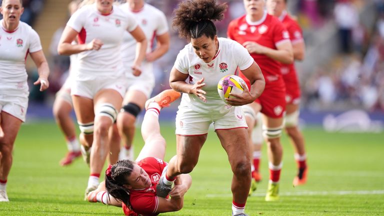 England's Tatyana Heard is tackled by Canada's Alysha Corrigan. Pic: PA
