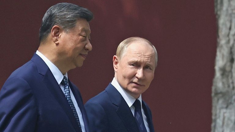 Putin and Xi take a walk at the Zhongnanhai leadership compound in Beijing. Pic: AP