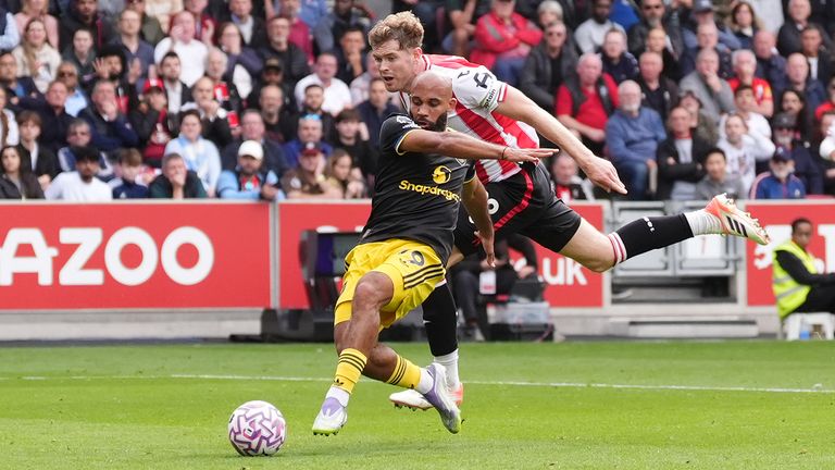 Manchester United's Bryan Mbeumo is fouled by Brentford's Nathan Collins, leading to a penalty
