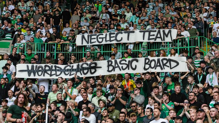 GLASGOW, SCOTLAND - AUGUST 23: Celtic fans hold banners that read "Neglect Team" and "Basic Board" during a William Hill Premiership match between Celtic and Livingston at Celtic Park, on August 23, 2025, in Glasgow, Scotland. (Photo by Craig Foy / SNS Group)