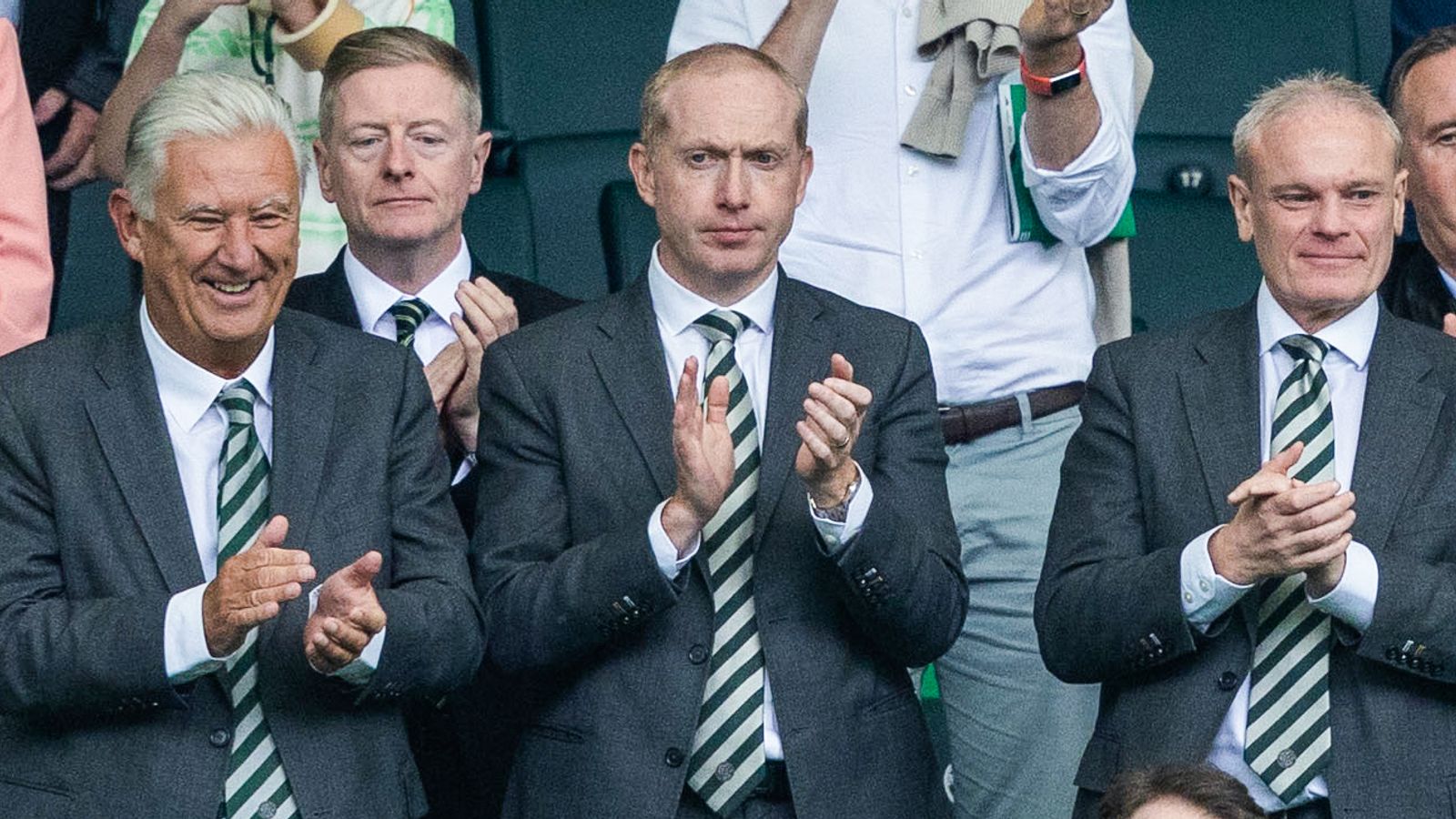 Celtic chairman Peter Lawwell (L) and chief exec Michael Nicholson (C)  were watching at Celtic Park