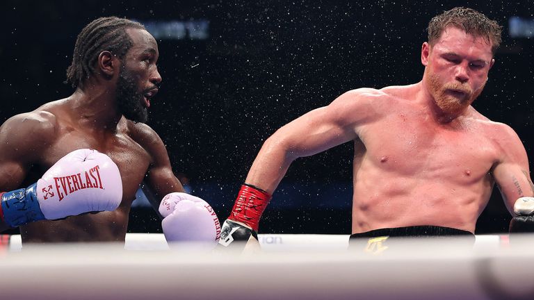 Terence Crawford (left) rocks opponent Saul 'Canelo' Alvarez with a punch in their fight on September 14, 2025