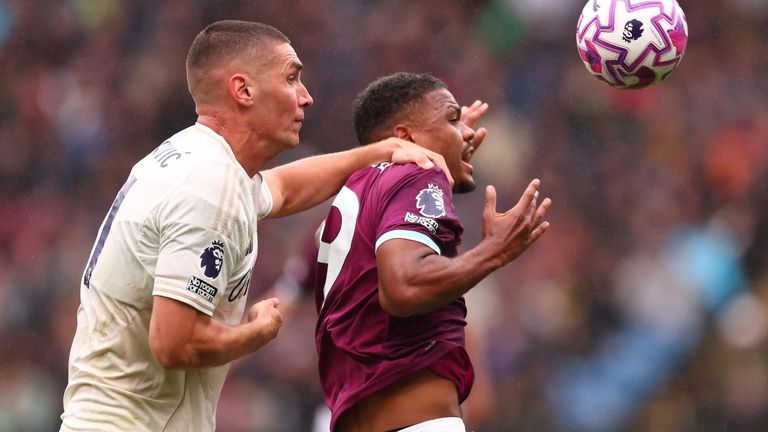 Nikola Milenkovic competes for the ball with Lyle Foster