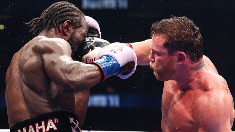 Saul 'Canelo' Alvarez (right) throws a right-hand punch at opponent Terence Crawford in Las Vegas fight on September 14, 2025