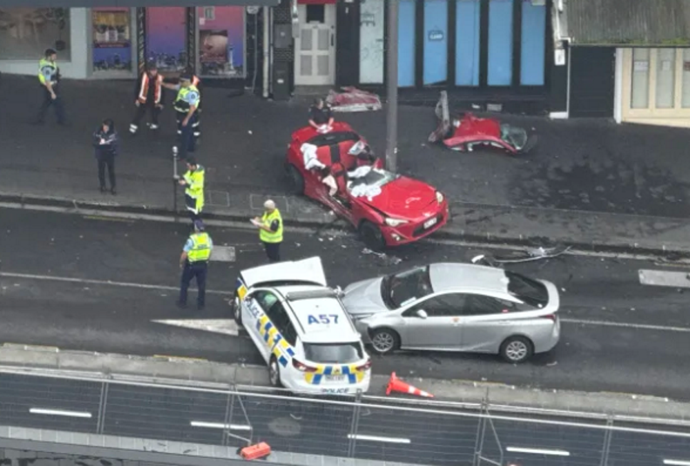 The car hit a patrol car and crashed into a lamppost. PHOTO: SUPPLIED