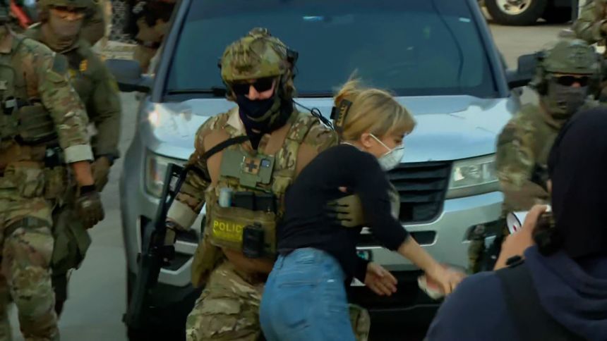  Kat Abughazaleh is thrown to the ground by ICE officers at the Broadview ICE facility in Illinois on September 19.
