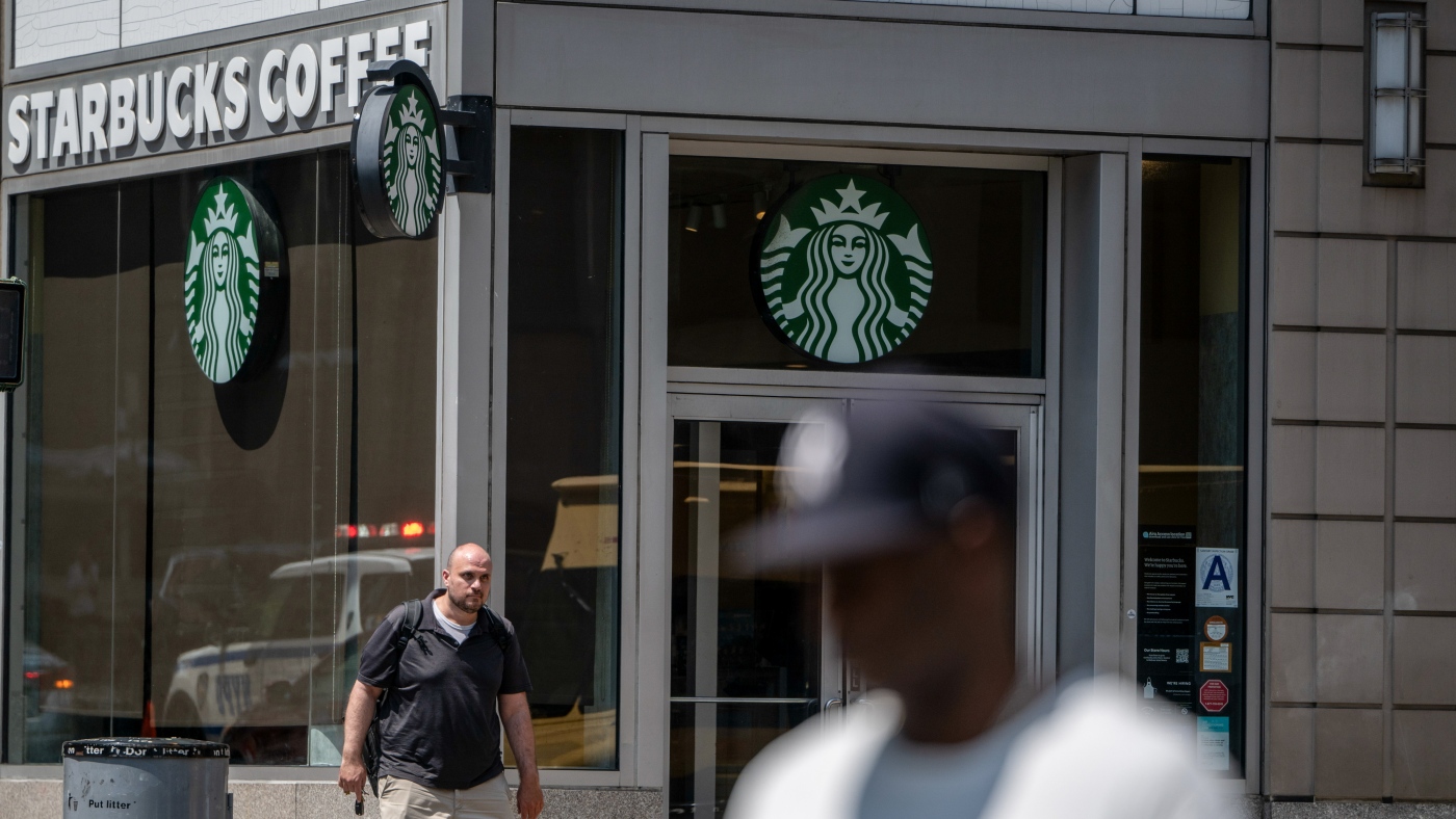Starbucks is closing stores, cutting 900 corporate jobs in a turnaround : NPR