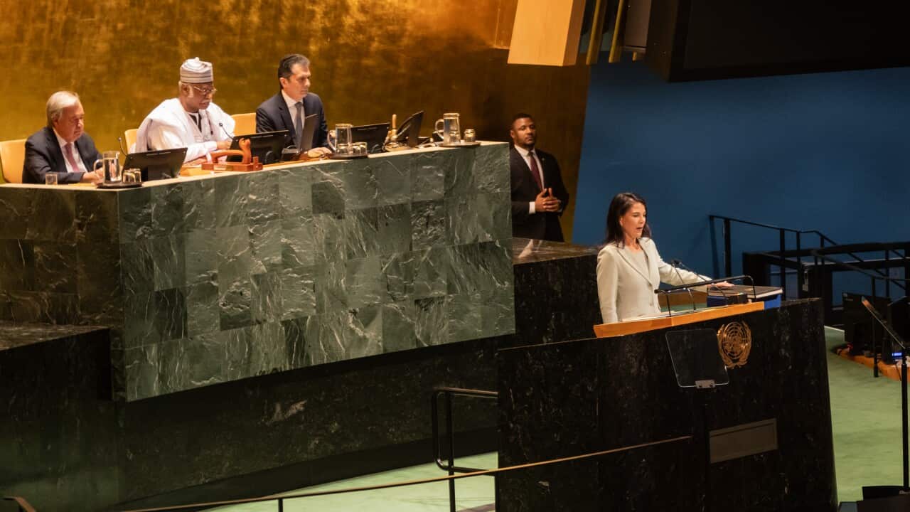 A woman stands at a podium speaking to the United Nations General Assembly