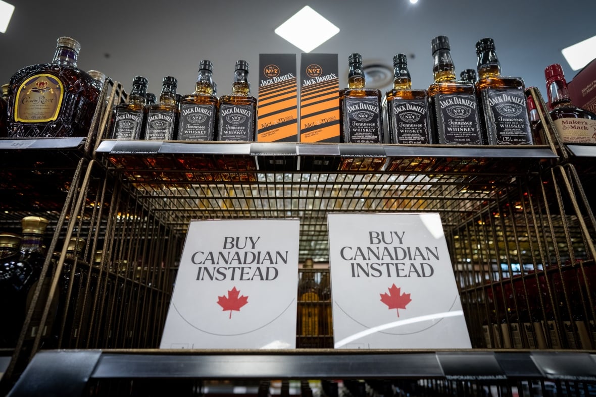 A sign is placed in front of the American whiskey section at a B.C. Liquor Store.