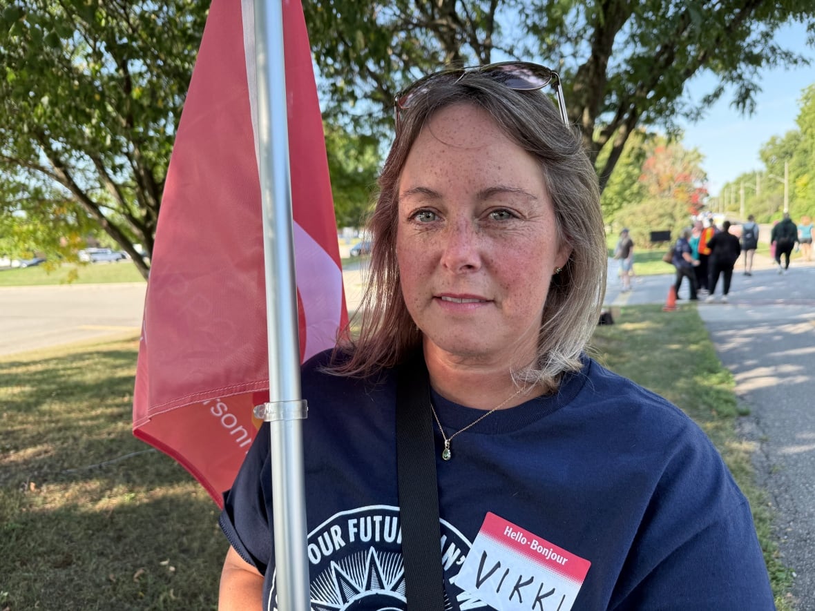 A woman holding a flag.