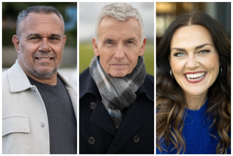 Three diverse individuals are featured in this image, each showcasing a distinct style. The man on the left wears a light-coloured jacket and has a confident smile. The middle man, dressed in a dark coat and scarf, presents a serious expression. The woman on the right, in a vibrant blue top, beams with a bright smile, highlighting her engaging personality. The background suggests an outdoor setting, adding to the overall warmth of the image.