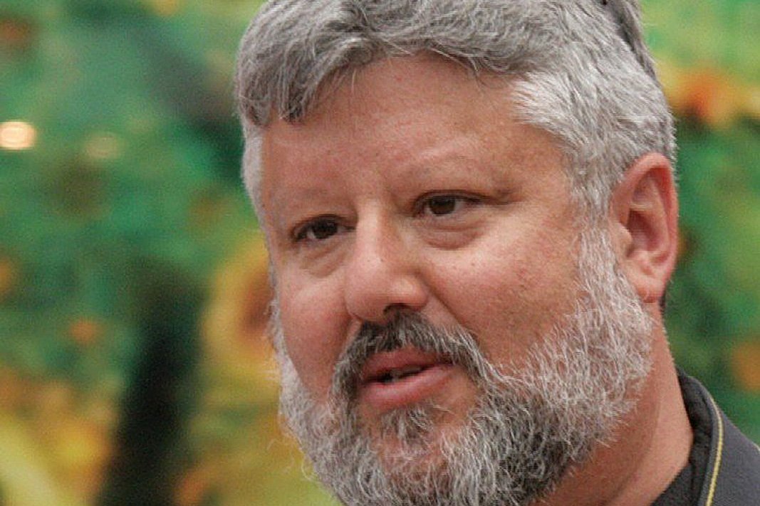 Gershon Baskin wearing a camera strap, photographed in 2008.