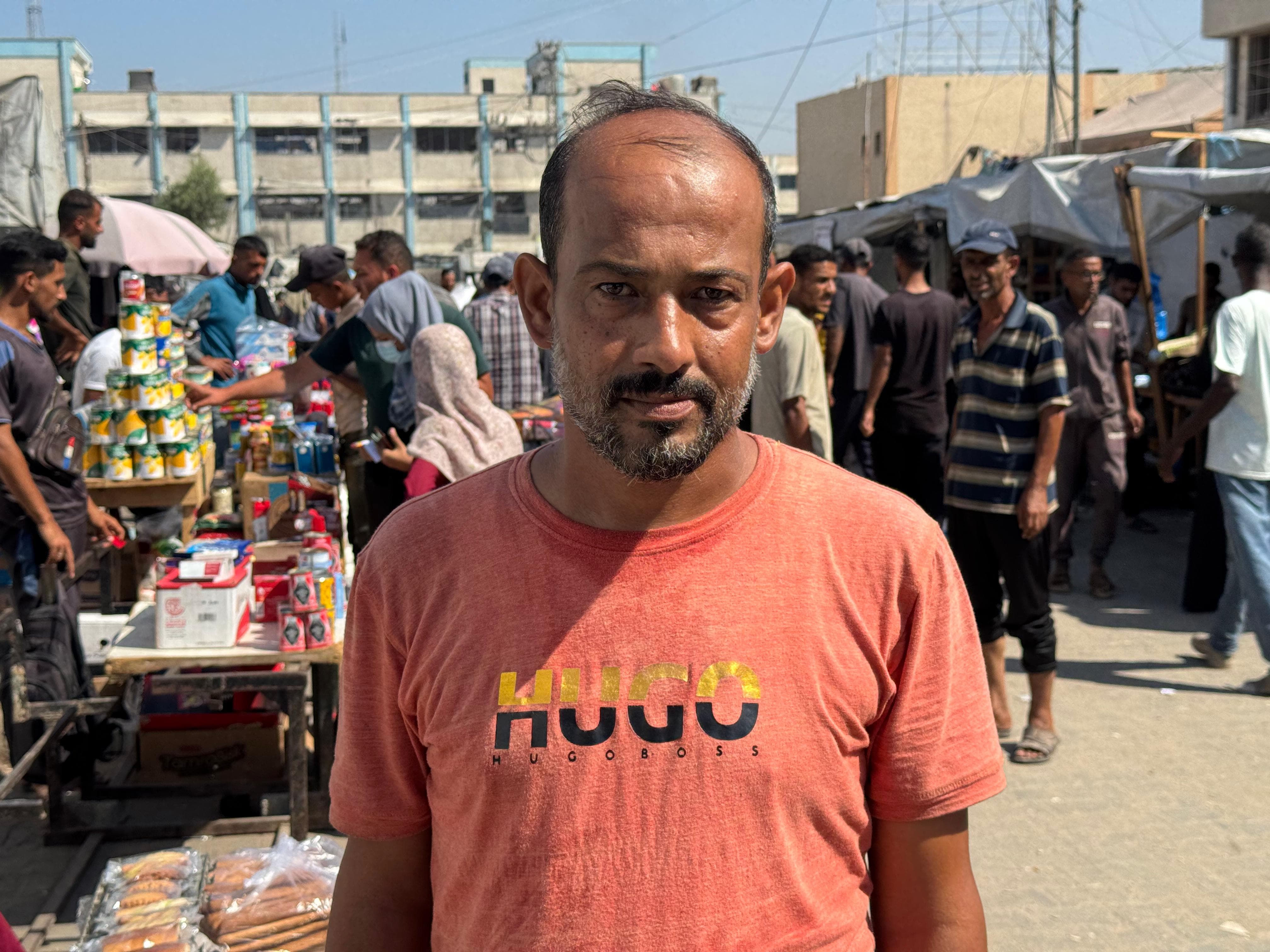 Sameer Abu Daqqa, 43, displaced from Khan Younis, stands in Al-Mawassi.